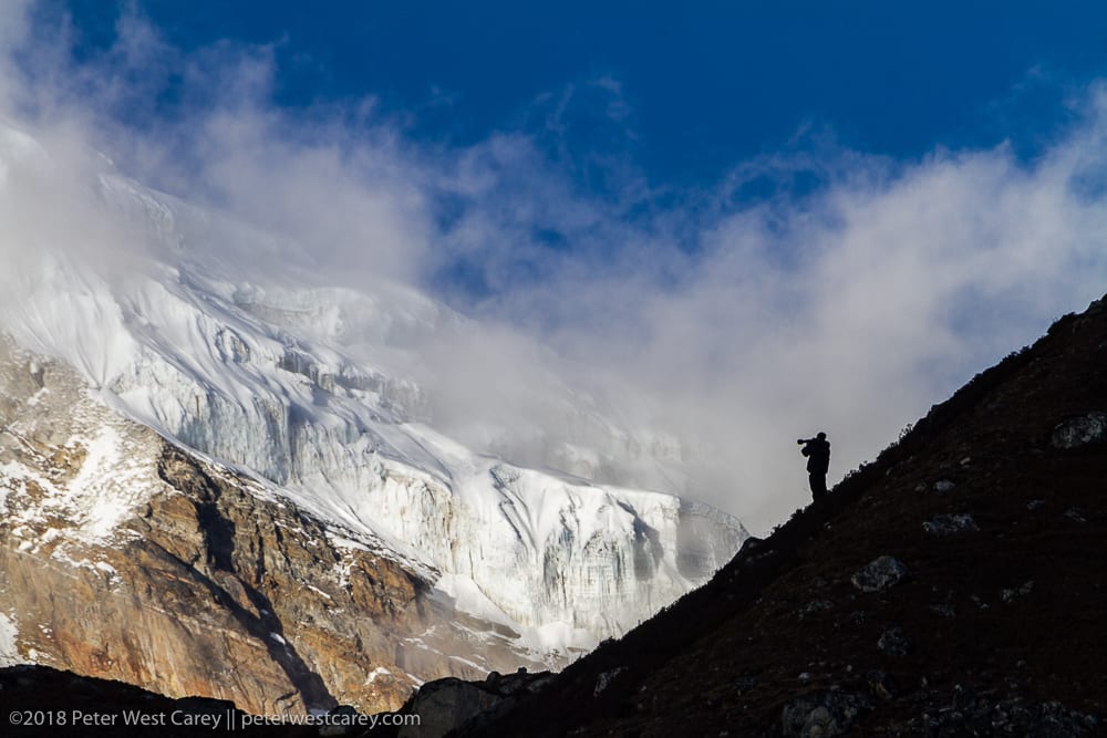 Photographer Silhouetted Against Cho Oyu, Nepal