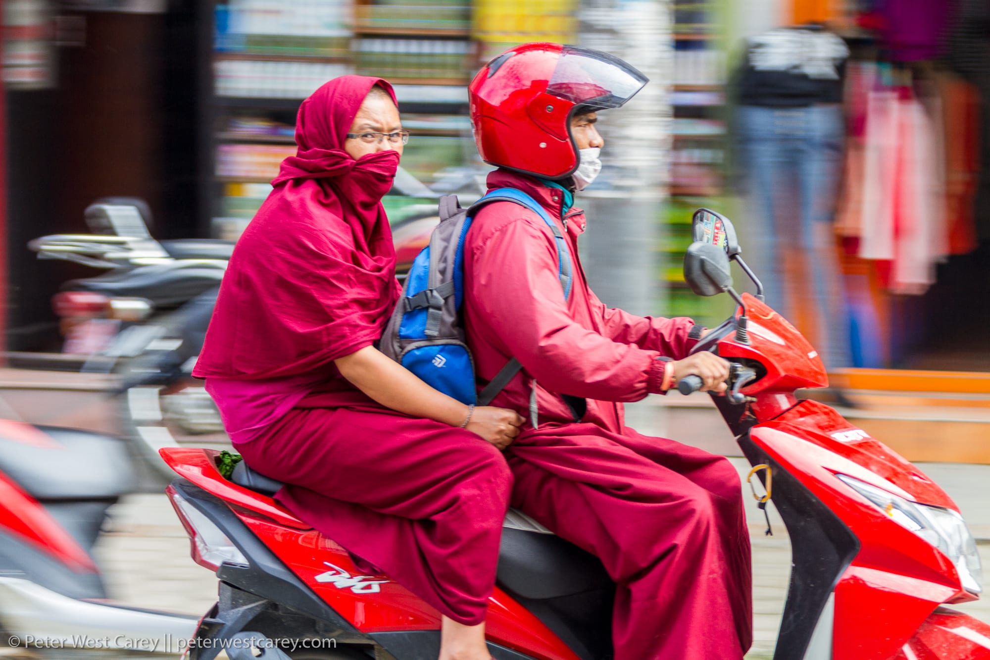 Monks riding on scooter – Nepal